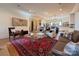 Spacious living room flowing into an open concept kitchen and staircase with stylish decor and ample seating at 2309 Pinckney Ave, Charlotte, NC 28205