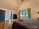 Comfortable bedroom with hardwood floors, a tray of mugs, and window views at 2309 Pinckney Ave, Charlotte, NC 28205