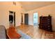 Spacious main bedroom with hardwood floors and ensuite bathroom and walk-in closet at 2309 Pinckney Ave, Charlotte, NC 28205