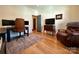 Cozy office with hardwood floors, a traditional desk, and a comfortable leather chair at 2309 Pinckney Ave, Charlotte, NC 28205