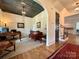 Stylish home office with custom ceiling, hardwood floors, and a cozy sitting area near the staircase at 2309 Pinckney Ave, Charlotte, NC 28205