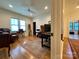 Inviting home office with hardwood floors, ceiling fan, and bright, natural light at 2309 Pinckney Ave, Charlotte, NC 28205