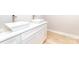 Bathroom featuring dual vessel sinks atop white cabinets and modern fixtures at 2350 14Th Street Ne Ct, Hickory, NC 28601