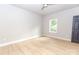 Bright bedroom with a ceiling fan, light-colored walls and floors, and a gray door at 2350 14Th Street Ne Ct, Hickory, NC 28601