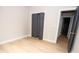 Cozy bedroom with light wood floors, closet, and doorway, providing a warm and inviting space at 2350 14Th Street Ne Ct, Hickory, NC 28601
