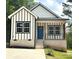 Charming new construction home featuring a modern design and a welcoming blue front door at 2350 14Th Street Ne Ct, Hickory, NC 28601