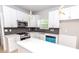 Modern kitchen featuring white cabinetry, stainless appliances, and marble countertops at 2350 14Th Street Ne Ct, Hickory, NC 28601