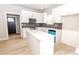 Modern kitchen featuring white cabinetry, black backsplash, stainless steel appliances, and quartz countertops at 2350 14Th Street Ne Ct, Hickory, NC 28601