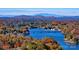 Scenic aerial view of a beautiful lake surrounded by colorful autumn foliage and mountains in the background at 2350 14Th Street Ne Ct, Hickory, NC 28601