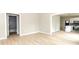 Bright living room with sleek wood floors, open floor plan leading to a modern kitchen and a bathroom at 2350 14Th Street Ne Ct, Hickory, NC 28601