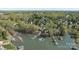 Aerial view of waterfront homes with docks, boats, and lush greenery, showcasing lakefront living at 255 Fernbrook Dr, Mooresville, NC 28117