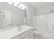 Clean bathroom with a large mirror, single sink vanity and a shower-tub combo with curtain at 255 Fernbrook Dr, Mooresville, NC 28117