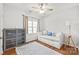 Inviting bedroom with daybed, hardwood floors, area rug, and decorative pillows at 255 Fernbrook Dr, Mooresville, NC 28117
