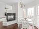 Cozy breakfast nook with fireplace and white table and chairs near bay windows at 255 Fernbrook Dr, Mooresville, NC 28117
