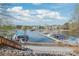 Picturesque lakeside docks with multiple boats, nestled in a serene waterfront community at 255 Fernbrook Dr, Mooresville, NC 28117
