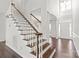 Elegant entryway showcasing a staircase with wood treads and white risers at 255 Fernbrook Dr, Mooresville, NC 28117