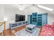 Entertainment space with shelving, a sleek TV, and a comfortable seating area at 255 Fernbrook Dr, Mooresville, NC 28117