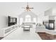 Bright living room featuring a vaulted ceiling, a fireplace, and hardwood floors at 255 Fernbrook Dr, Mooresville, NC 28117