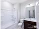 Clean bathroom with a tub and shower combination, toilet, and a vanity with a dark wood cabinet at 2579 Ruby Dixon Crossing Dr # 12, Gastonia, NC 28056