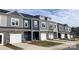 New townhomes with stone accents, garages, modern windows, and professional landscaping at 2579 Ruby Dixon Crossing Dr # 12, Gastonia, NC 28056