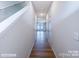 Bright hallway with hardwood floors, leading to bedrooms, and freshly painted walls at 2579 Ruby Dixon Crossing Dr # 12, Gastonia, NC 28056