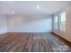 Spacious living room with hardwood flooring and large windows, offering ample natural light at 2579 Ruby Dixon Crossing Dr # 12, Gastonia, NC 28056