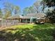 The backyard features a green lawn, a sunroom and patio with a gazebo at 271 Ikerd Se Dr, Concord, NC 28025
