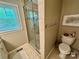 Bathroom featuring a glass enclosed shower, toilet, and towel rack at 271 Ikerd Se Dr, Concord, NC 28025