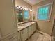 Bathroom with dual sinks, granite counters, and a glass enclosed shower at 271 Ikerd Se Dr, Concord, NC 28025