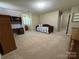 Bedroom with neutral carpeting, a twin bed, and built-in desk at 271 Ikerd Se Dr, Concord, NC 28025