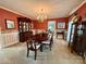 Traditional dining room featuring wood furniture, chandelier, and carpet flooring at 271 Ikerd Se Dr, Concord, NC 28025