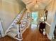 Inviting foyer features hardwood floors, staircase, and elegant lighting, creating a warm welcome at 271 Ikerd Se Dr, Concord, NC 28025