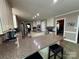 Large kitchen with island seating, built-in appliances, and wood-look floors at 271 Ikerd Se Dr, Concord, NC 28025