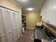 Functional laundry room with washer, dryer, storage cabinets, and a folding area at 271 Ikerd Se Dr, Concord, NC 28025