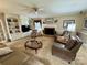 Spacious living room with fireplace, ceiling fan, built-in shelves, and carpet floors at 271 Ikerd Se Dr, Concord, NC 28025