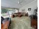 Bright carpeted living room with vaulted ceilings, large windows, and comfortable seating at 271 Ikerd Se Dr, Concord, NC 28025