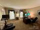 Spacious home office equipped with a desk, treadmill, and natural light, ideal for work and exercise at 271 Ikerd Se Dr, Concord, NC 28025