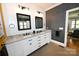Bathroom featuring a double vanity with granite countertops and modern fixtures at 2757 Trent Ne Dr, Conover, NC 28613