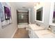 Bathroom featuring a tub and shower combo with a tile backsplash and a double vanity at 2757 Trent Ne Dr, Conover, NC 28613