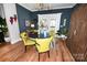 Cozy dining area with unique light fixture, round table, and adjacent to an outdoor patio at 2757 Trent Ne Dr, Conover, NC 28613