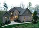 Charming two-story home with a brick exterior, landscaped yard, and inviting entrance at 2757 Trent Ne Dr, Conover, NC 28613