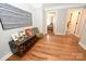 Foyer with hardwood floors, an antique trunk, and a view to the bedroom at 2757 Trent Ne Dr, Conover, NC 28613