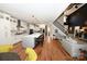 Open concept living space with kitchen island, hardwood floors, and staircase to the upper level at 2757 Trent Ne Dr, Conover, NC 28613