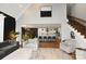 Open concept living room with kitchen view, modern decor, and plenty of natural light at 2757 Trent Ne Dr, Conover, NC 28613