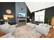 Open living room with high ceilings, a modern fireplace, stylish decor, and abundant natural light at 2757 Trent Ne Dr, Conover, NC 28613