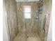 Updated shower with tile surround, mosaic floor, and glass doors at 2757 Trent Ne Dr, Conover, NC 28613