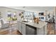 Bright and airy kitchen with modern appliances, an island, and a view into the living room at 282 Bezelle Ave, York, SC 29745