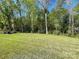 Expansive backyard offers lots of green space for outdoor activities at 3081 Montreaux Valley Dr, Fort Mill, SC 29707