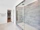 Modern shower with rainfall shower head, glass enclosure, seating area, and a closet in the bathroom at 3081 Montreaux Valley Dr, Fort Mill, SC 29707