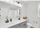 The bathroom has double sink with light gray cabinets and a light countertop at 3081 Montreaux Valley Dr, Fort Mill, SC 29707